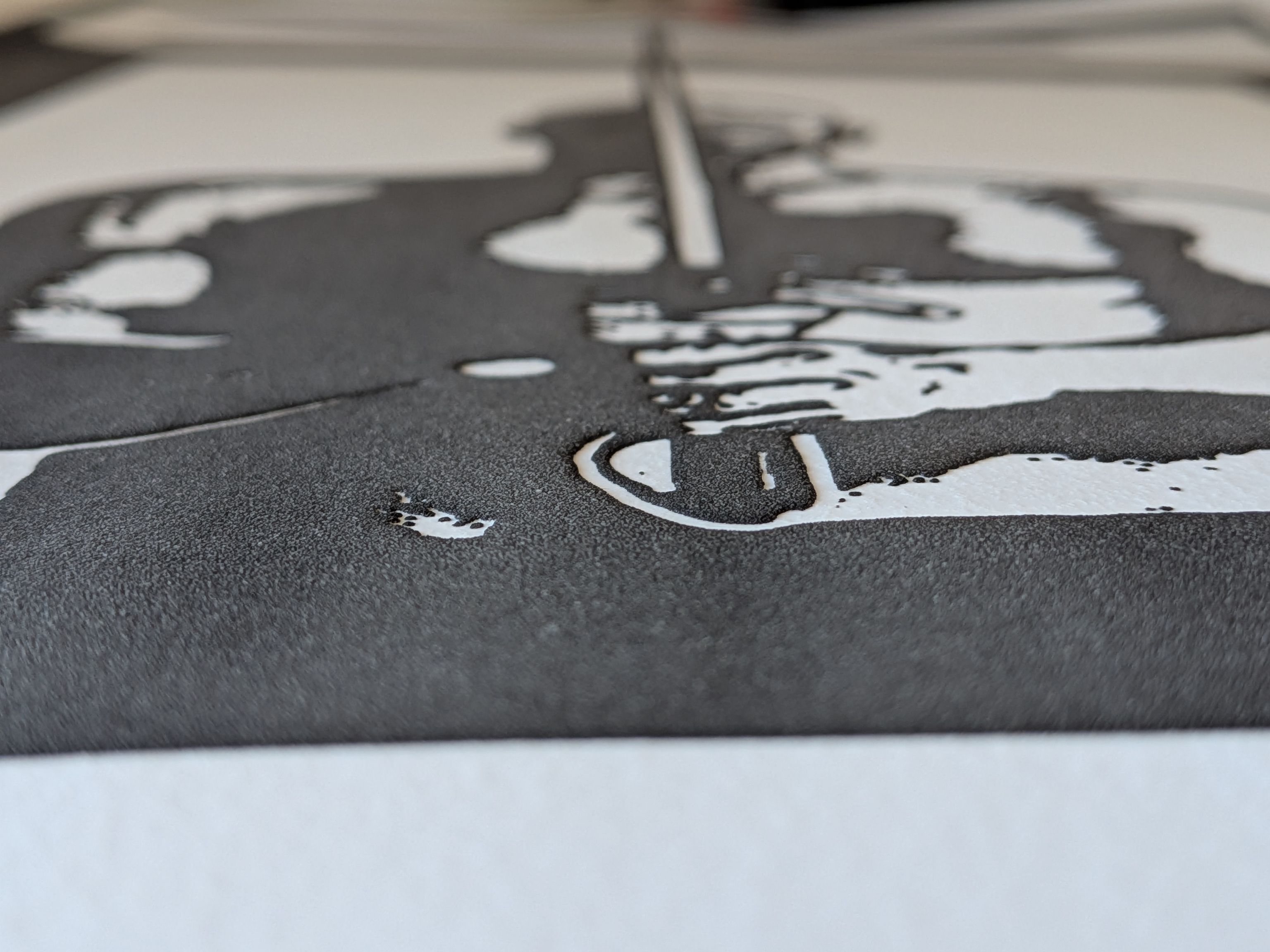 Close up photo of the swell form print showing the area around Lynn Manning's hands.